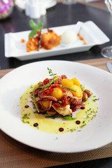 Seafood appetizer and other food on table