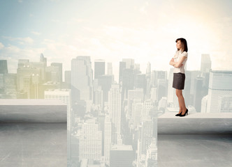 Businesswoman standing on the edge of rooftop