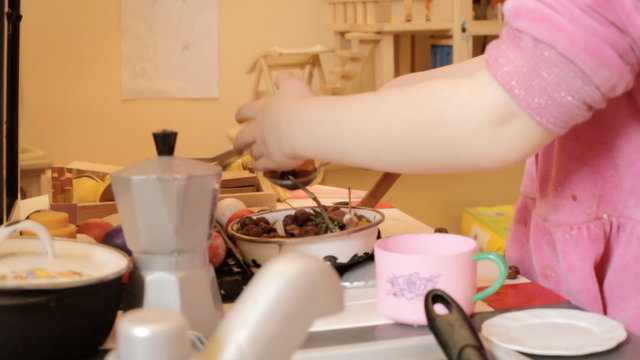 Little girl mess toy kitchen hands
