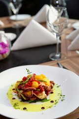 Appetizer with grilled octopus, potatoes and vegetables