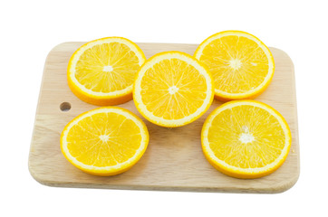 Pieces of Orange on a cutting wooden board