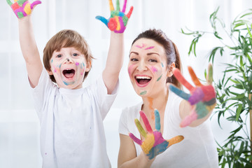 Child painting with mum