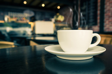Coffee cup on the table at the coffee shop.