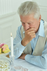 Fototapeta premium Pensive elderly man