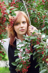 Young woman in a blossoming garden