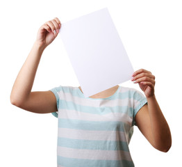 Woman covering her face with blank sheet of paper isolated on white