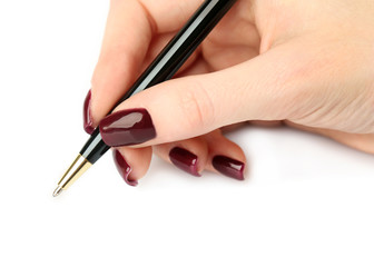 Ballpoint pen in female hand isolated on white