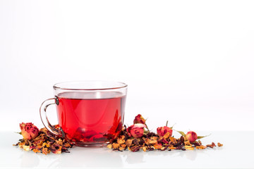 isolated transparent mug of red tea with dried rose