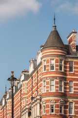 Fototapeta na wymiar Vintage Red Brick Castle-like Building in London, UK
