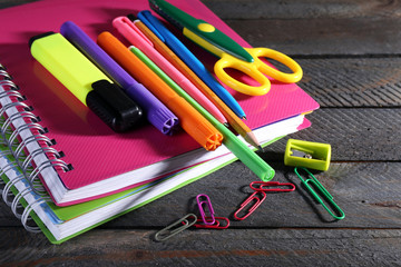 Colorful stationery on wooden background