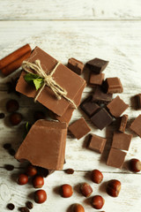 Set of chocolate on wooden table, top view