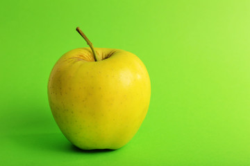 Apple on color background