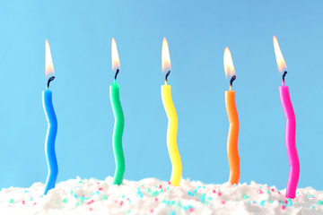 Birthday cake with candles on color background