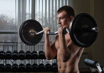Obraz na płótnie Canvas Young man at the gym