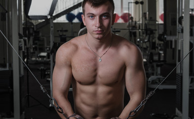 Fototapeta na wymiar Young man at the gym