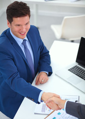 Business people shaking hands, finishing up a meeting