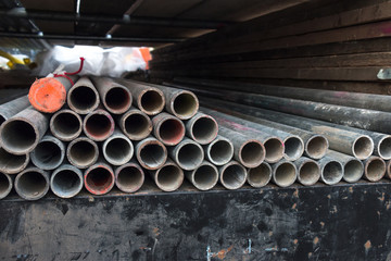 Metal Pipe Pile on the back of a car