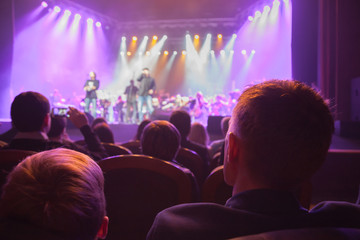 Audience watching the scene with artists.