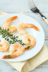 Tasty shrimp on white plate
