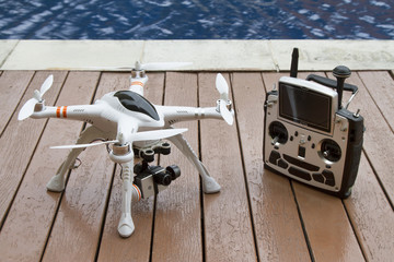 A quadcopter with camera gimbal system and radio transmitter
