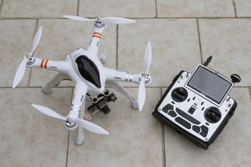 A quadcopter with camera gimbal system and radio transmitter