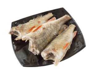Fried perch on a black plate