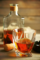 Whiskey on wooden background
