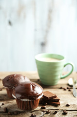 Tasty homemade chocolate muffins and cup of coffee