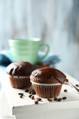 Tasty homemade chocolate muffins and cup of coffee