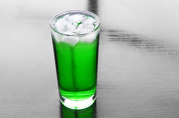 Green cocktail on table close-up