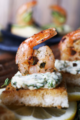 Appetizer canape with shrimp and lemon
