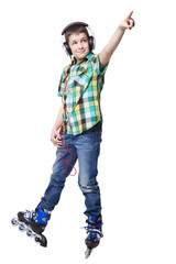 Full length portrait a boy on rollers pointing up sign isolated