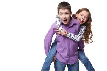Little girl enjoying riding on boy isolated on white background