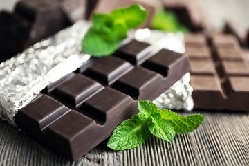 Set of spicy chocolate on wooden table, closeup