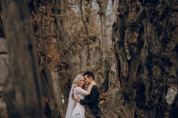 bride walking in golden autumn nature