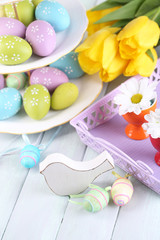Easter decoration, eggs and tulips on table close-up