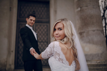 Naklejka premium bride walking in golden autumn nature