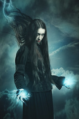 Dark witch calling thunder powers - obrazy, fototapety, plakaty
