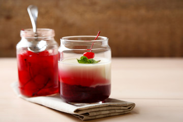 Glass jar with tasty panna cotta dessert