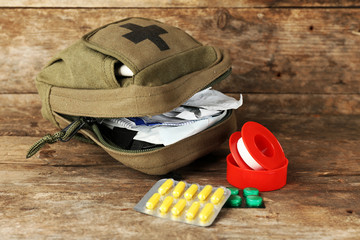 Medicine chest on wooden background