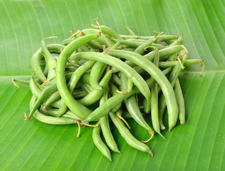 green beans on banana leaf