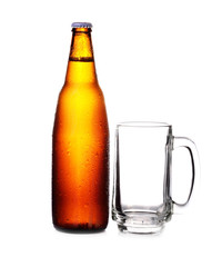 bottle of beer and empty Glass isolated on a white background