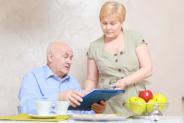 Couple works with documents