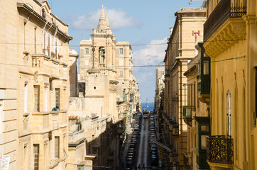 Fototapeta na wymiar Old narrow street of european town (Valletta, Malta)