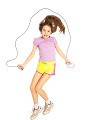 Isolated photo of smiling girl jumping with skipping rope