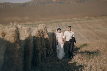 happy wedding couple in a field