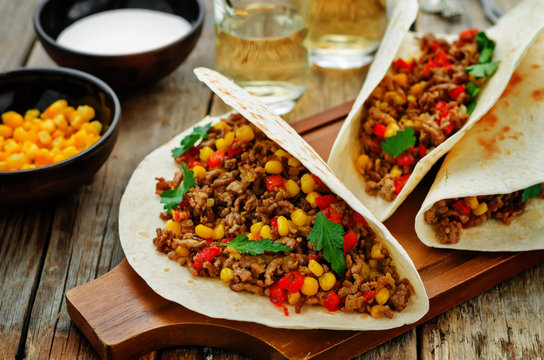 tacos with meat, corn and peppers