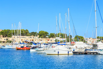 Fototapeta na wymiar Boats in a port in San Vito Lo Capo, Sicily, Italy