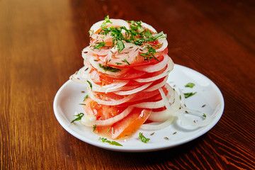 Uzbek national salad of tomatoes, onions, herbs and spices, chop