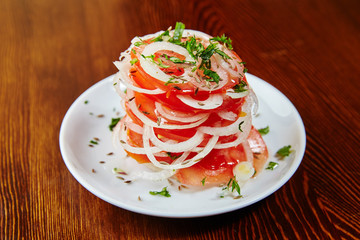 Uzbek national salad of tomatoes, onions, herbs and spices, chop